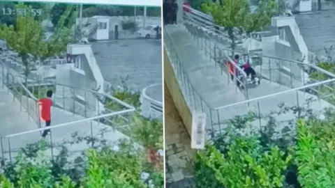 Adıyaman'da yüreklere dokunan görüntü: Aniden yağmur bastırınca engelli arkadaşının yardımına koştu