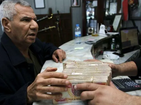 Irak'tan devalüasyon kararı - fotoğraf 1